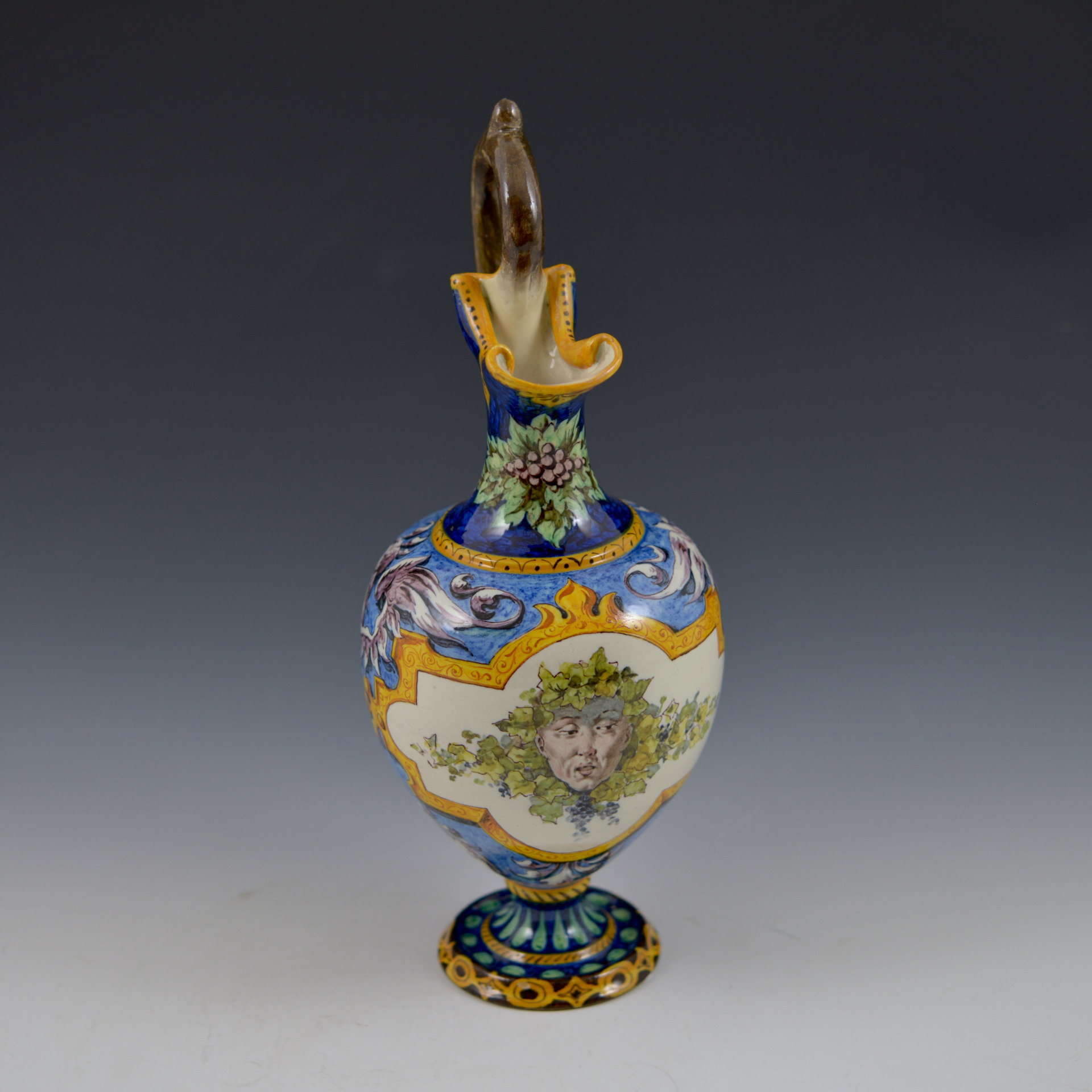Pitcher with vine branch handle and decoration depicting the face of Bacchus